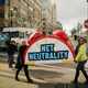 Rally organizers carry away props following a protest outside the Federal Communications Commission building against the end of net neutrality rules Dec. 14, 2017, in Washington, D.C. (Chip Somodevilla/Getty Images)
